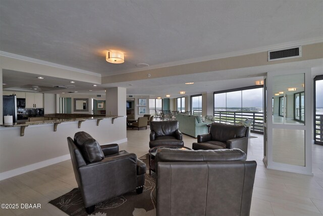3855 S Atlantic Ave S Unit 1405, Daytona Beach, FL 32118 - interior space featuring baseboards, visible vents, ornamental molding, and a raised ceiling