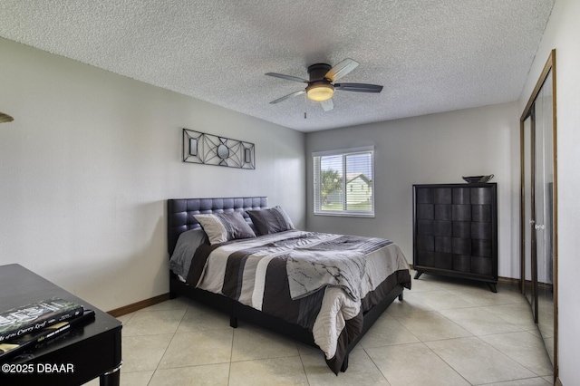 29 Concord Dr, Ormond Beach, FL 32176 - bedroom with light tile patterned floors, ceiling fan, and a textured ceiling
