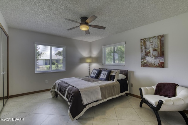 29 Concord Dr, Ormond Beach, FL 32176 - tiled bedroom featuring a textured ceiling and a ceiling fan