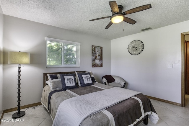 29 Concord Dr, Ormond Beach, FL 32176 - bedroom featuring light tile patterned floors, a textured ceiling, and a ceiling fan