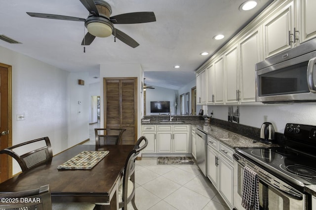 29 Concord Dr, Ormond Beach, FL 32176 - kitchen with appliances with stainless steel finishes, a ceiling fan, recessed lighting, white cabinetry, and light tile patterned floors