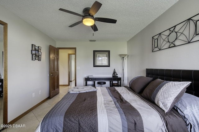 29 Concord Dr, Ormond Beach, FL 32176 - bedroom featuring light tile patterned floors, a textured ceiling, and ceiling fan