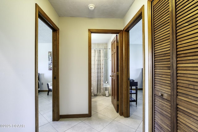 29 Concord Dr, Ormond Beach, FL 32176 - corridor with light tile patterned floors and baseboards