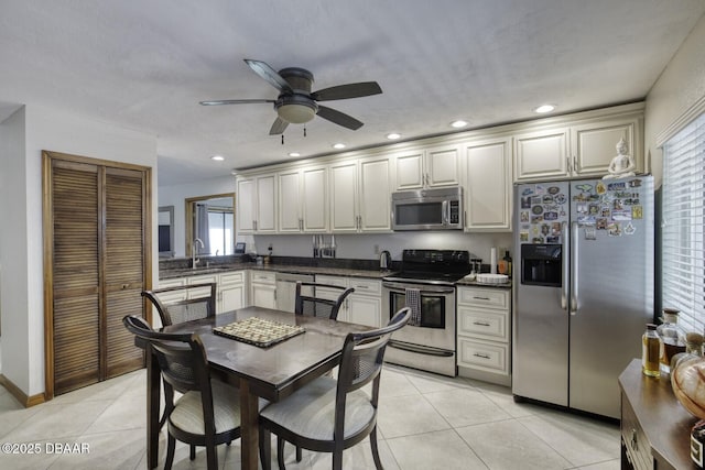 29 Concord Dr, Ormond Beach, FL 32176 - kitchen with stainless steel appliances, dark countertops, ceiling fan, light tile patterned flooring, and recessed lighting