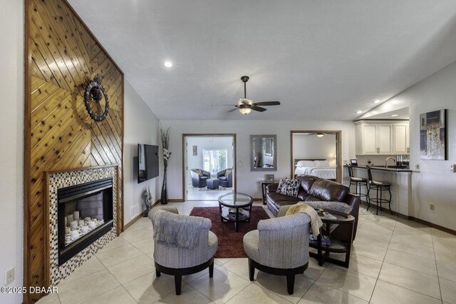 29 Concord Dr, Ormond Beach, FL 32176 - living room with light tile patterned floors, ceiling fan, a fireplace, and recessed lighting