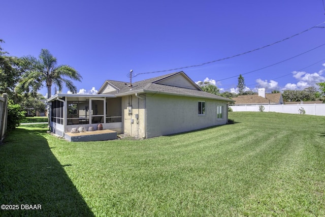 29 Concord Dr, Ormond Beach, FL 32176 - rear view of house featuring a sunroom and stucco siding
