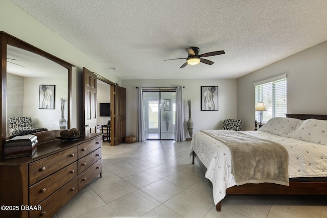 29 Concord Dr, Ormond Beach, FL 32176 - bedroom with light tile patterned flooring, a textured ceiling, and ceiling fan