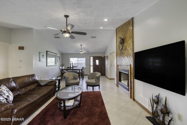 29 Concord Dr, Ormond Beach, FL 32176 - living area with lofted ceiling, light tile patterned floors, a ceiling fan, a fireplace, and recessed lighting