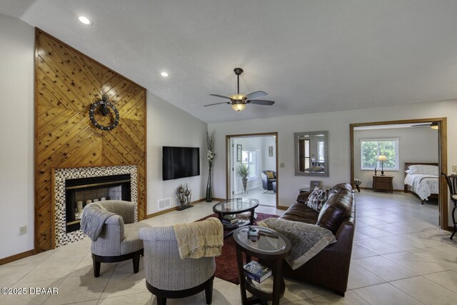 29 Concord Dr, Ormond Beach, FL 32176 - living area with light tile patterned flooring, lofted ceiling, recessed lighting, a ceiling fan, and a tile fireplace