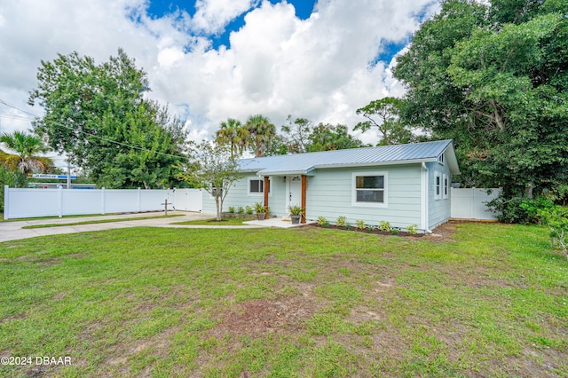 ranch-style house with a front lawn