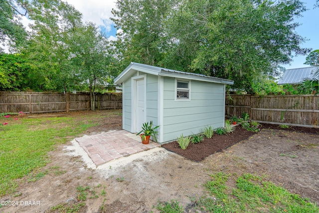 view of outdoor structure featuring a lawn