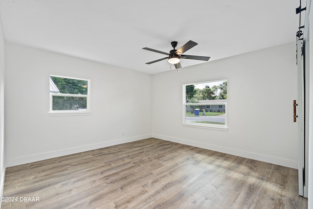 unfurnished room with ceiling fan and light hardwood / wood-style flooring