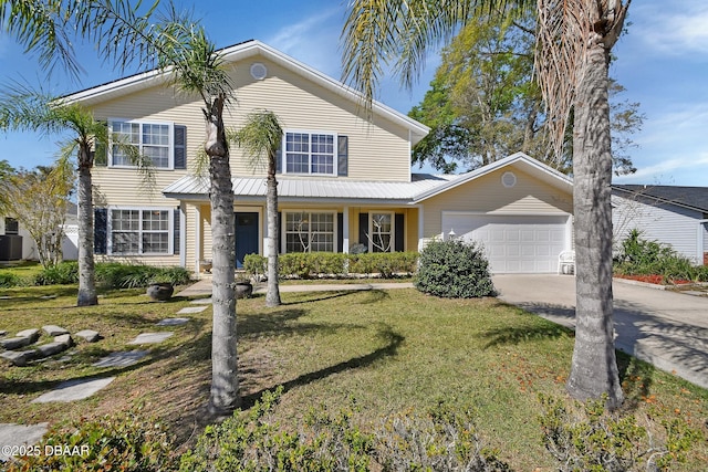 traditional-style home with an attached garage, central air condition unit, concrete driveway, and a front yard