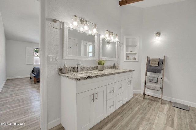 bathroom featuring vanity and hardwood / wood-style floors