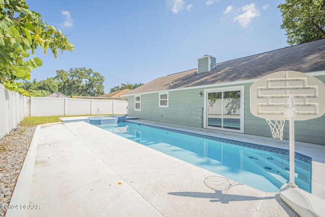 view of swimming pool featuring a patio