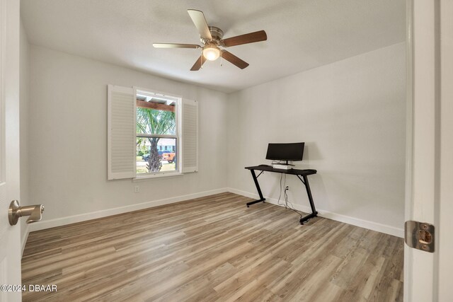 unfurnished room featuring ceiling fan and light hardwood / wood-style flooring