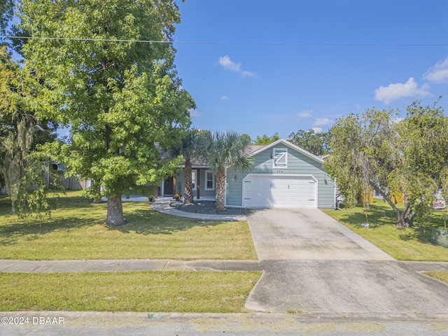 view of front facade with a front lawn and a garage