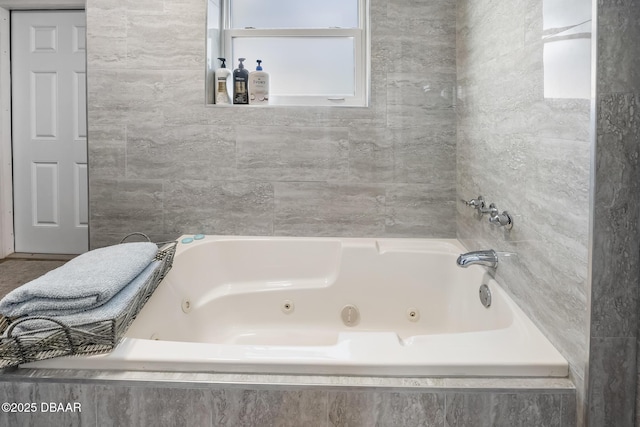 full bathroom featuring a whirlpool tub