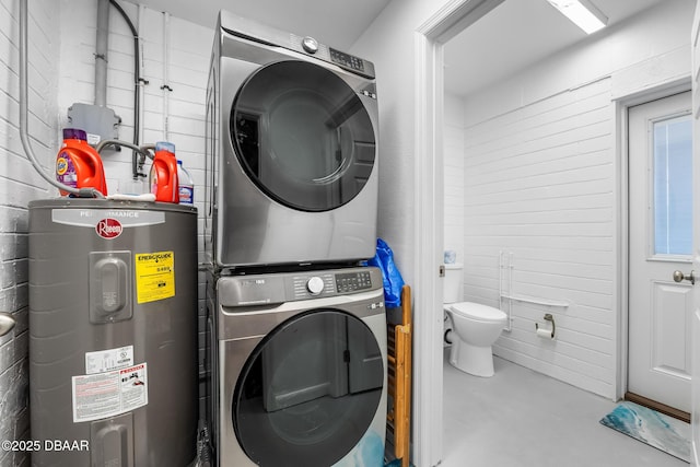 laundry area with water heater, laundry area, and stacked washing maching and dryer