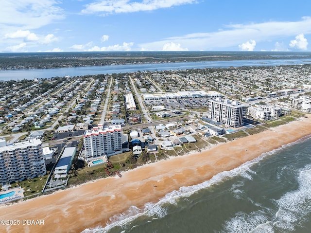 drone / aerial view featuring a water view and a city view