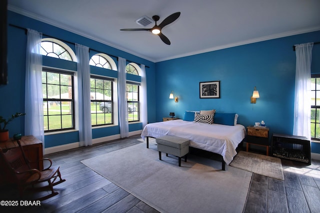 1948 Spruce Creek Lndg, Port Orange, FL 32128 - bedroom with wood finished floors, ceiling fan, baseboards, visible vents, and crown molding