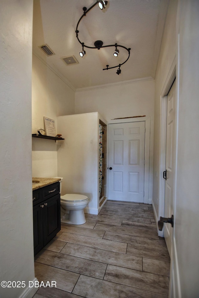 1948 Spruce Creek Lndg, Port Orange, FL 32128 - full bath with visible vents, toilet, ornamental molding, and vanity