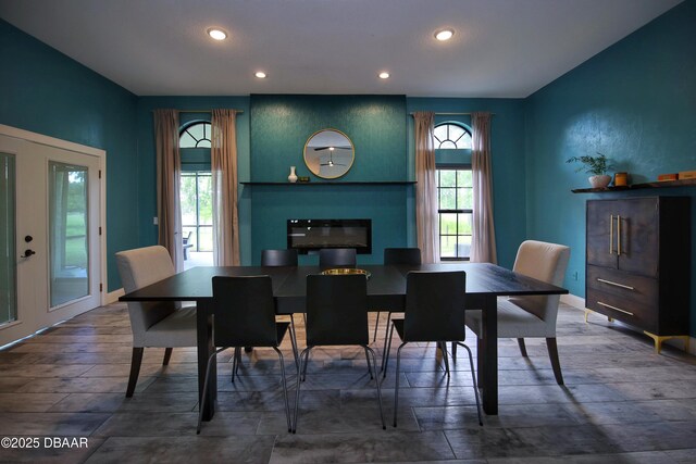 1948 Spruce Creek Lndg, Port Orange, FL 32128 - dining room with recessed lighting, a large fireplace, wood finished floors, and baseboards
