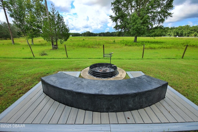 1948 Spruce Creek Lndg, Port Orange, FL 32128 - deck with a rural view, a yard, and an outdoor fire pit