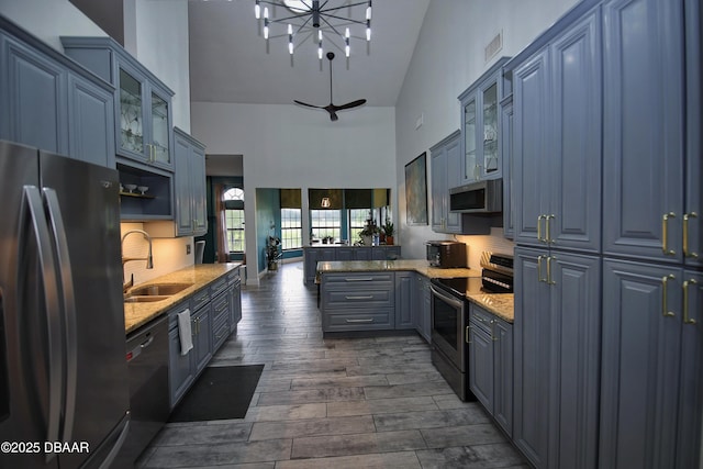 1948 Spruce Creek Lndg, Port Orange, FL 32128 - kitchen featuring a sink, tasteful backsplash, visible vents, a towering ceiling, and appliances with stainless steel finishes
