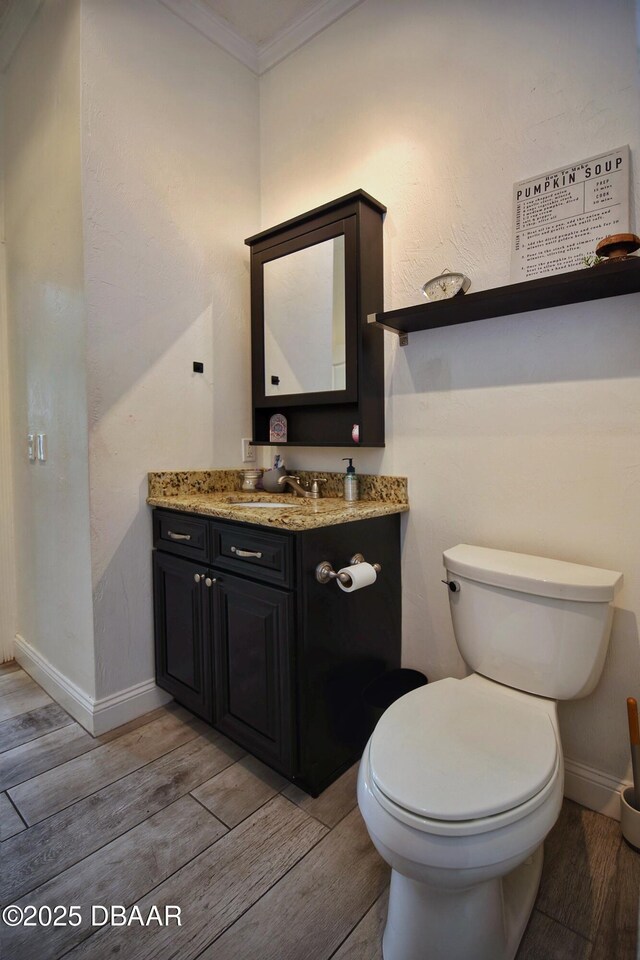1948 Spruce Creek Lndg, Port Orange, FL 32128 - half bath featuring crown molding, vanity, toilet, and wood finished floors