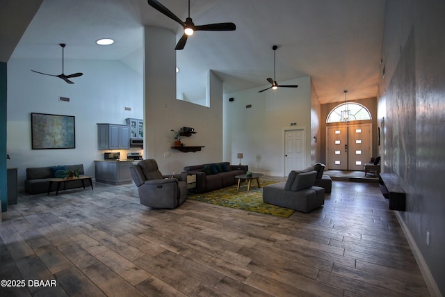 1948 Spruce Creek Lndg, Port Orange, FL 32128 - living room with dark wood finished floors, high vaulted ceiling, and a ceiling fan