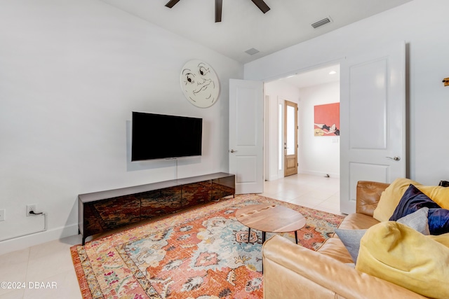 living room featuring light tile patterned floors, ceiling fan, and lofted ceiling