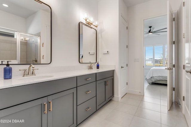 bathroom with tile patterned floors, ceiling fan, vanity, and walk in shower