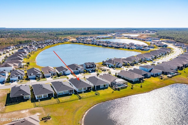 birds eye view of property featuring a water view