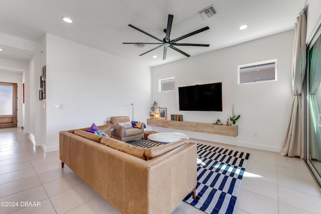 living room featuring ceiling fan and light tile patterned flooring