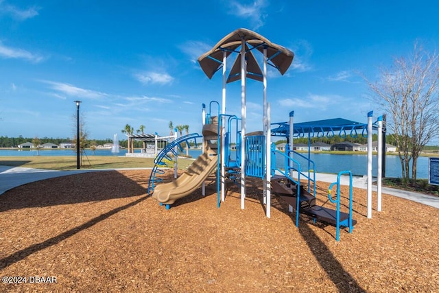 view of jungle gym featuring a water view