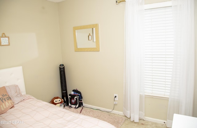 bedroom featuring baseboards