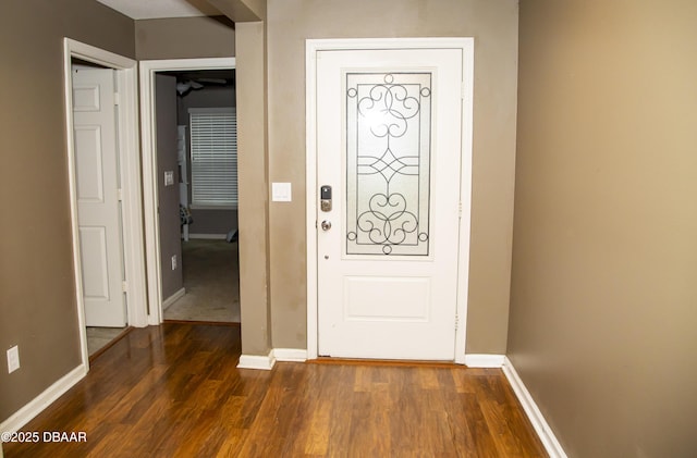 interior space featuring dark wood finished floors and baseboards