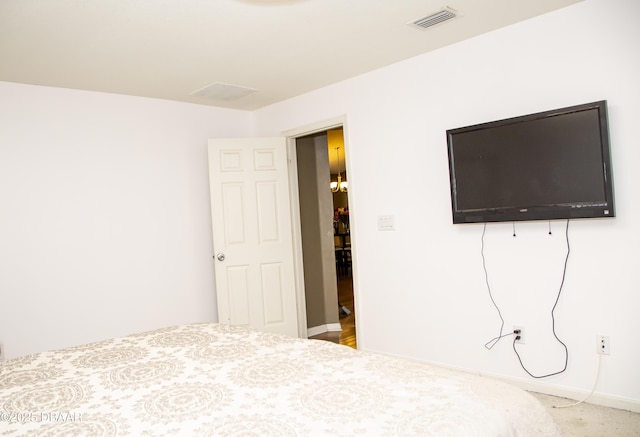 unfurnished bedroom featuring baseboards and visible vents