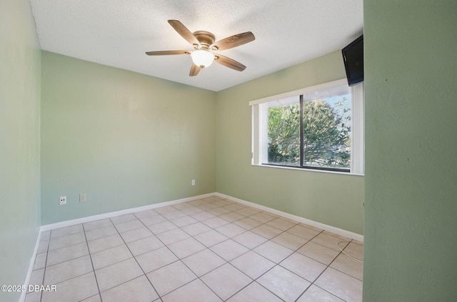 10 Lake Forest Cir N, Palm Coast, FL 32137 - spare room with baseboards, a textured ceiling, and ceiling fan