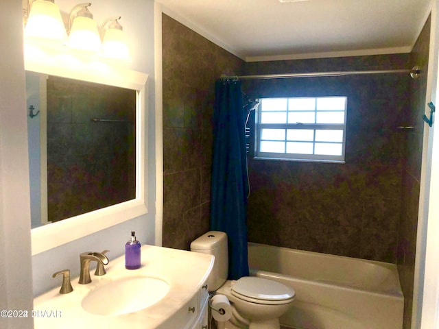 full bathroom featuring shower / bath combo with shower curtain, vanity, and toilet