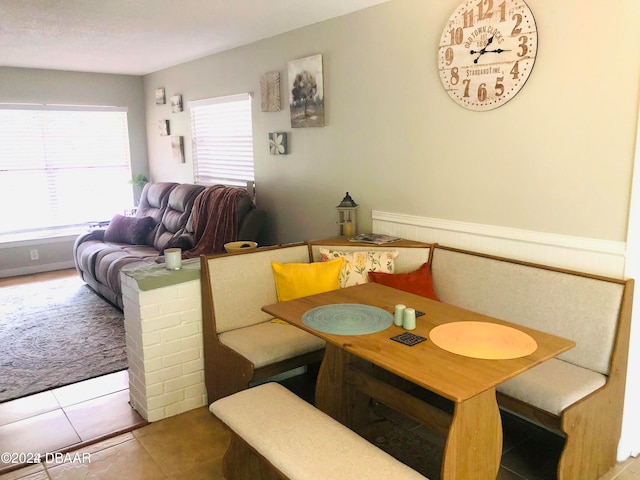 tiled dining space featuring breakfast area