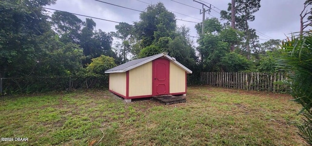 view of outdoor structure with a lawn