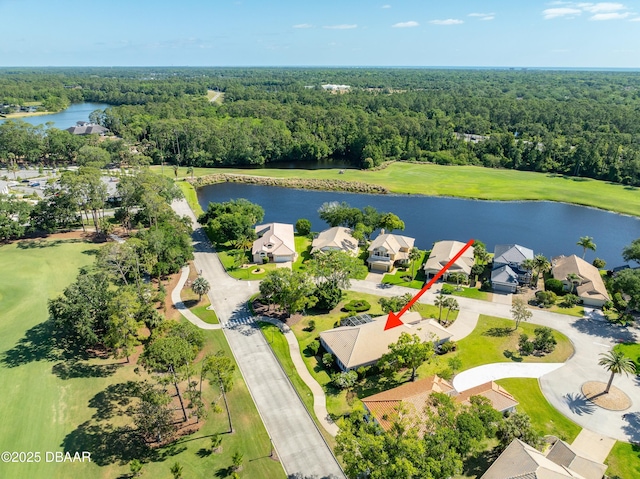 aerial view featuring a water view and a forest view