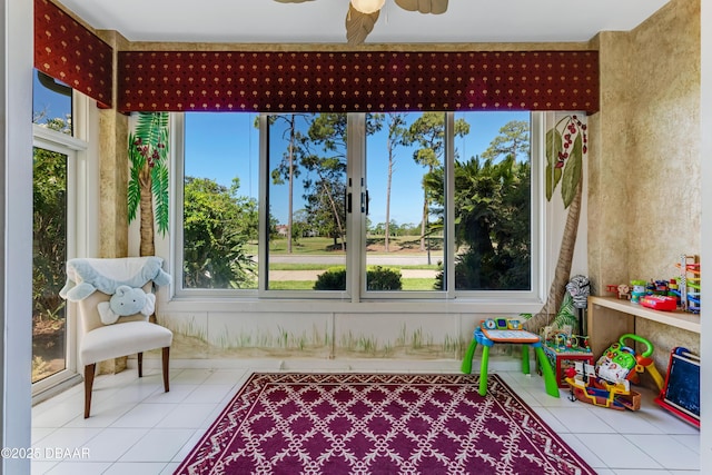 sunroom / solarium featuring tile patterned flooring and a wealth of natural light