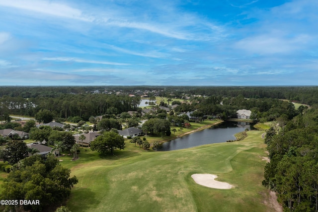 drone / aerial view with a water view, view of golf course, and a residential view