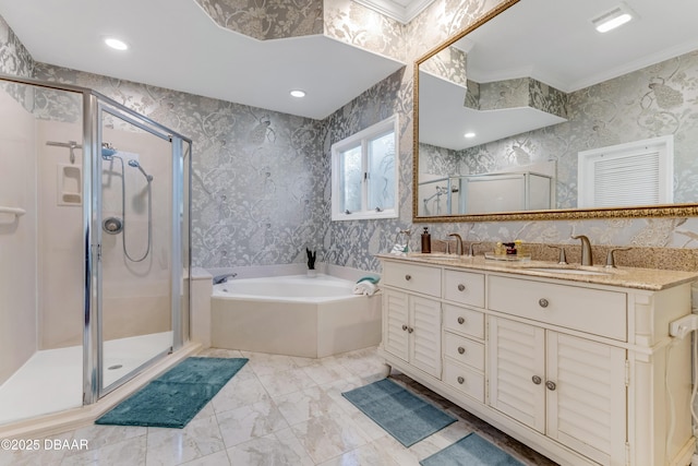 bathroom featuring double vanity, a shower stall, a sink, and a bath