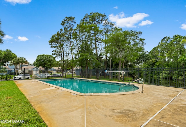 view of swimming pool featuring a patio area