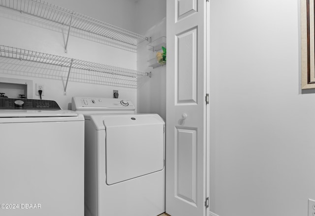 laundry area featuring washing machine and clothes dryer