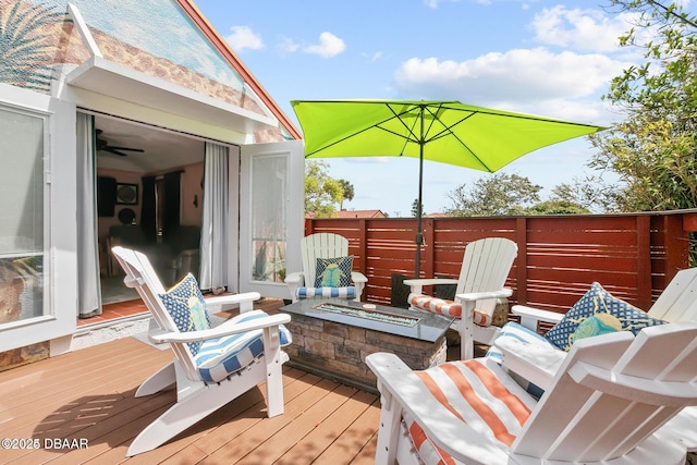 330 Bostwick Ave, Daytona Beach, FL 32118 - deck featuring an outdoor fire pit and fence